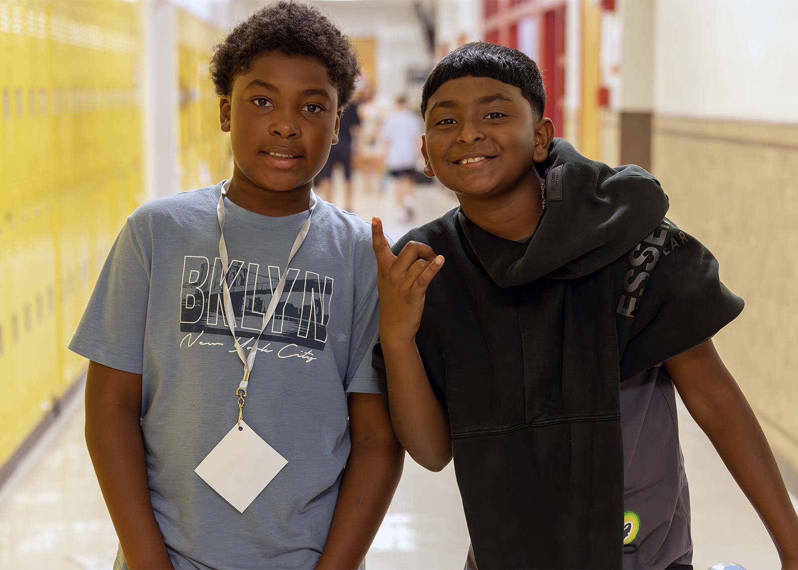 students smiling in the hall
