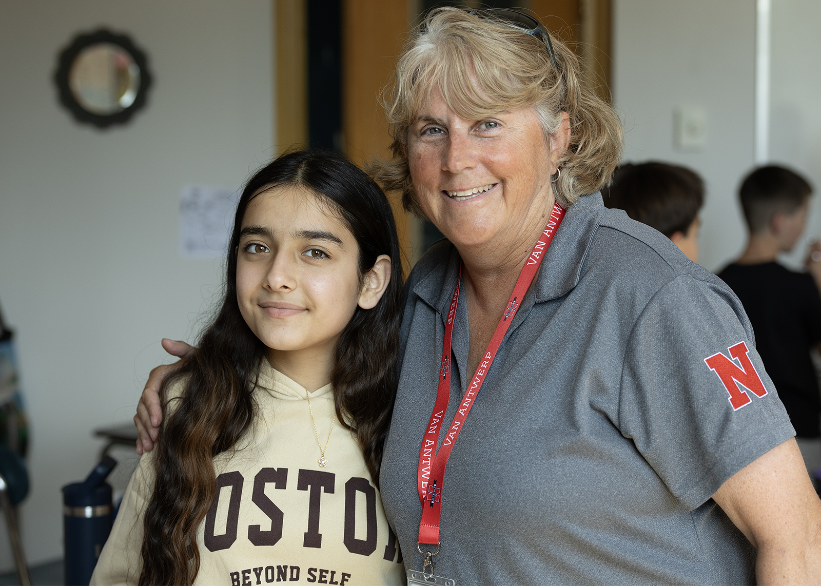 teacher and student smiling