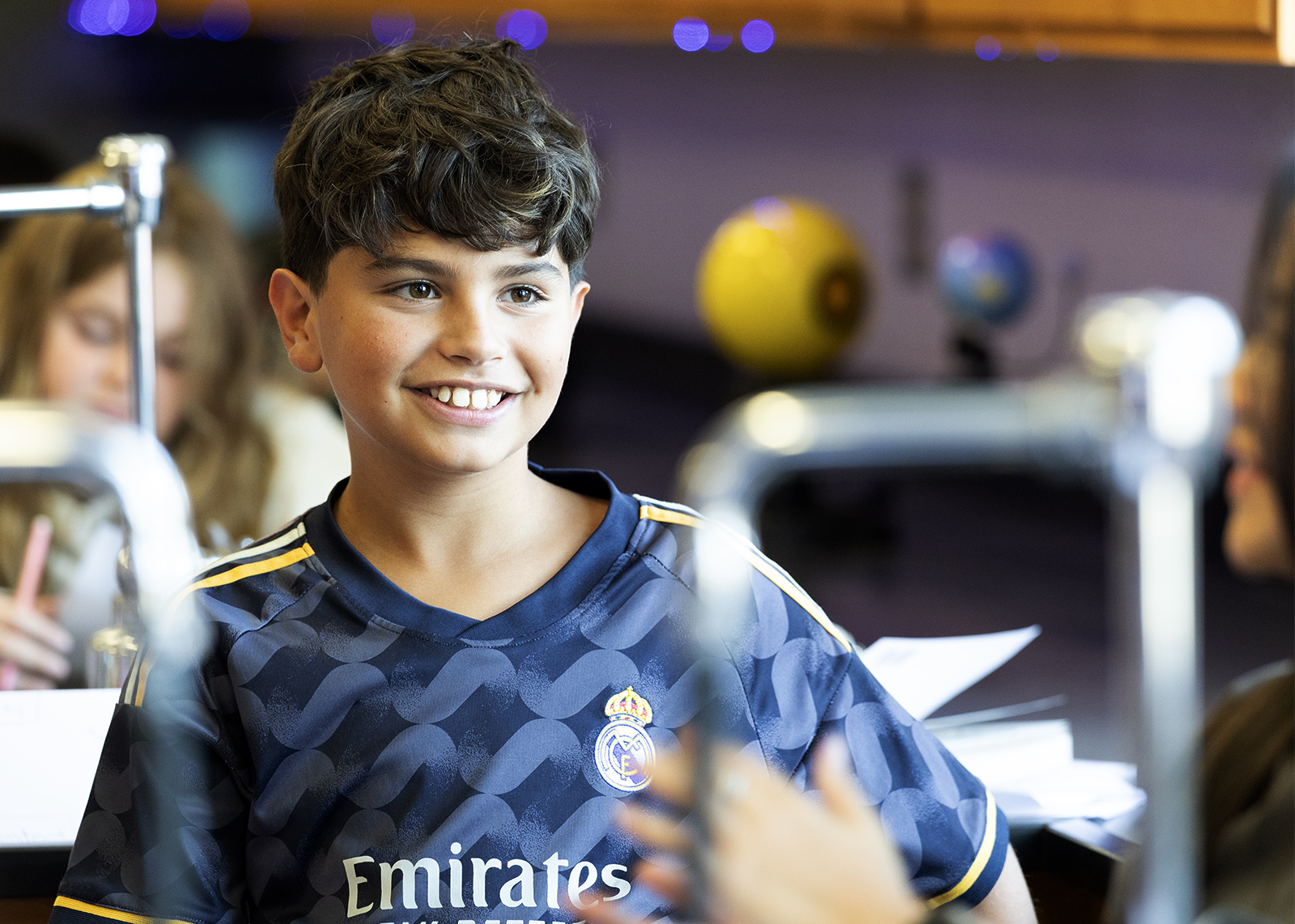 sixth grader smiling at classmate