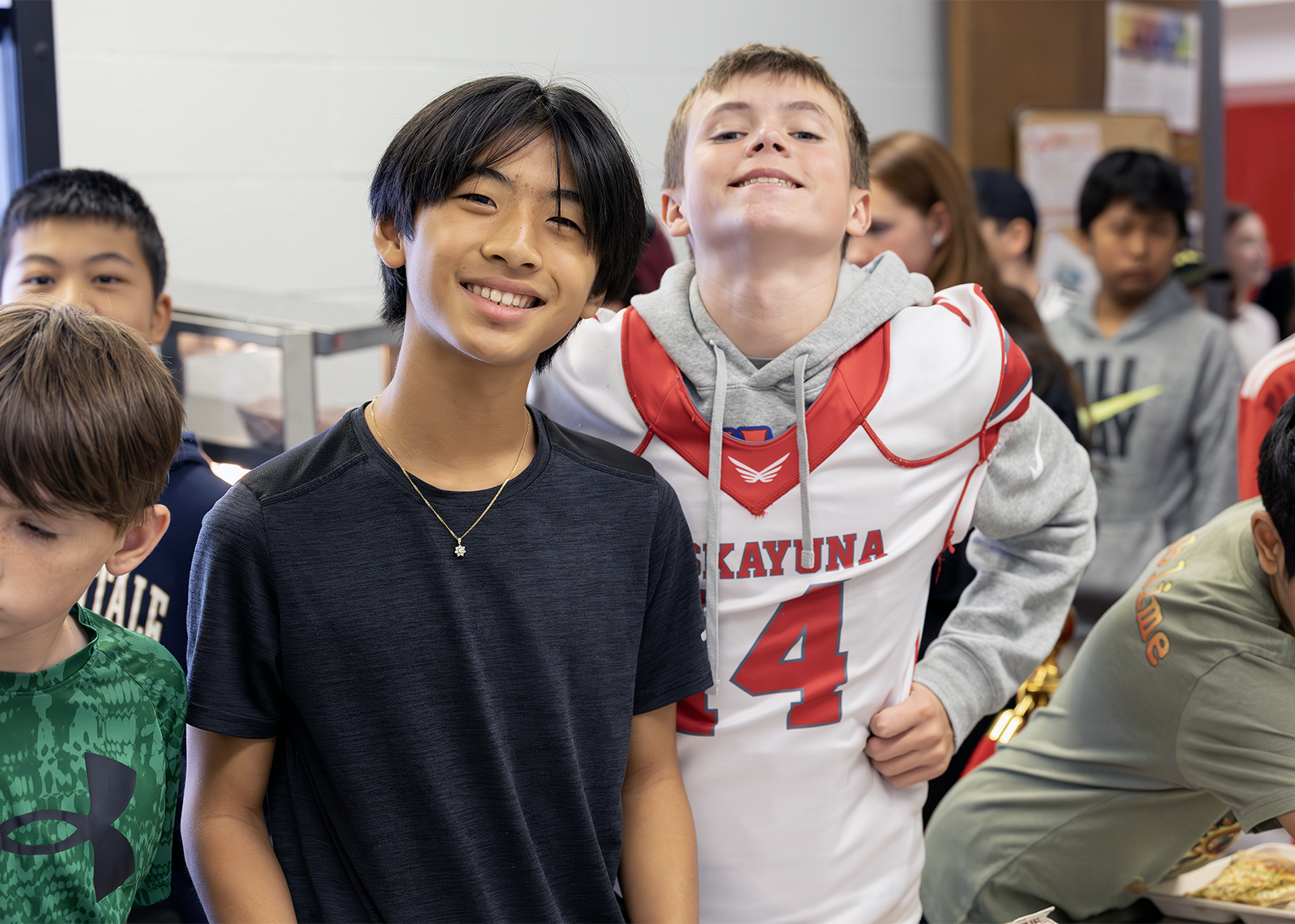 two middle school students in the lunch line