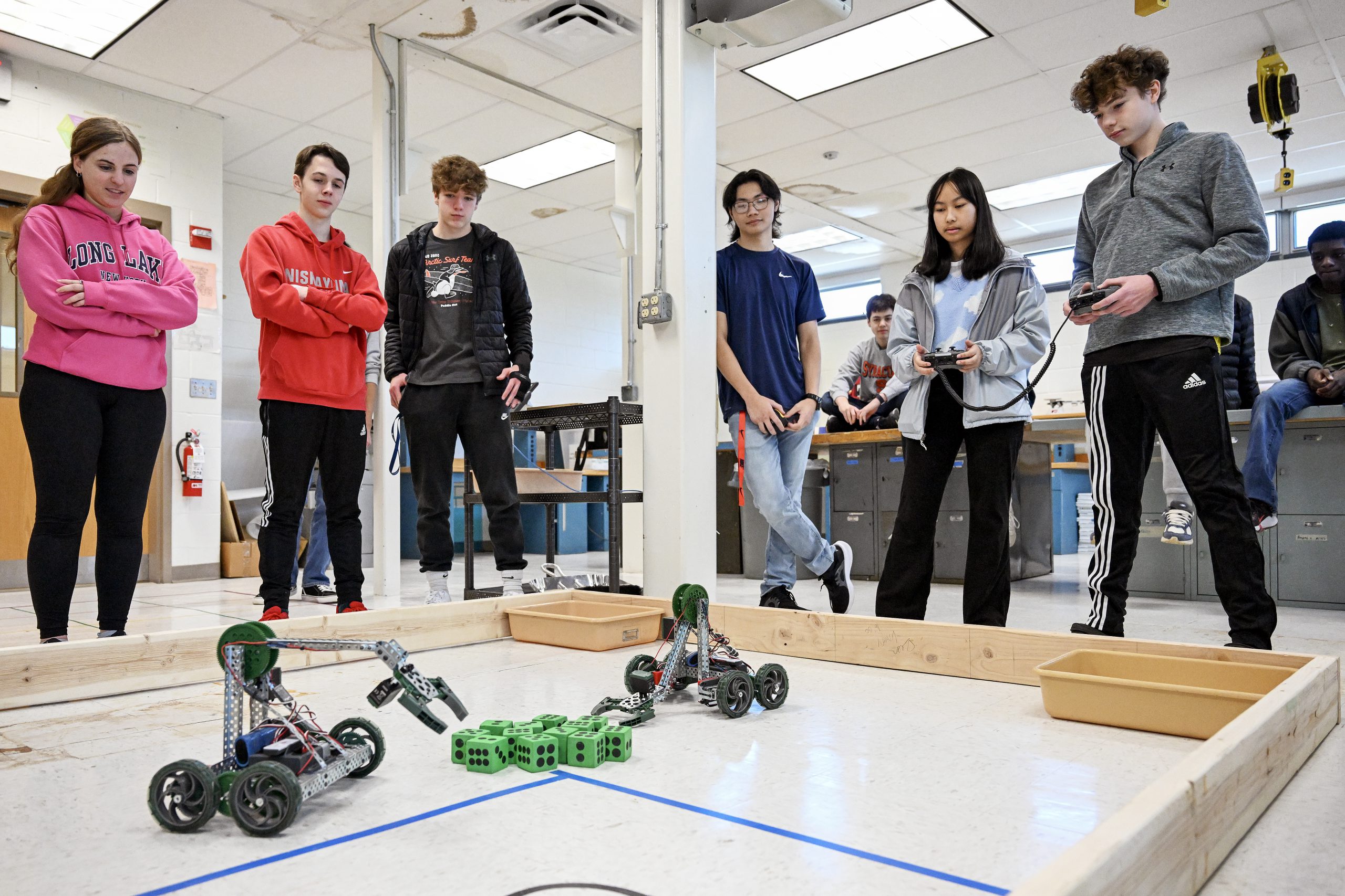 Students watch robotics challenge.