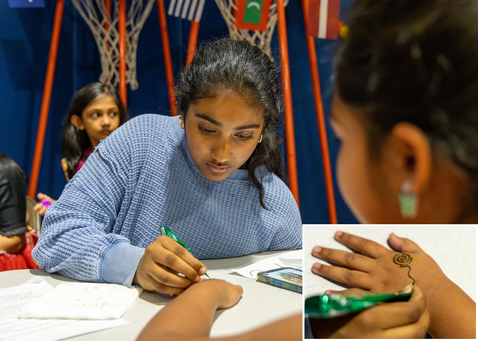 student doing henna at mulitcultural fair