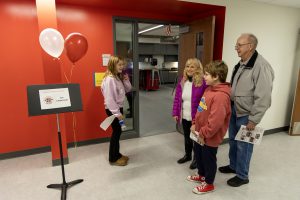 attendees tour the new spaces at the school