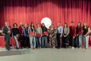 Board and student-athletes pose for group photos.