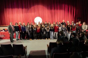 Board and student-athletes pose for group photos.