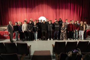 Board and student-athletes pose for group photos.