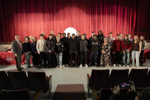 Board and student-athletes pose for group photos, no students are holding awards, group photo