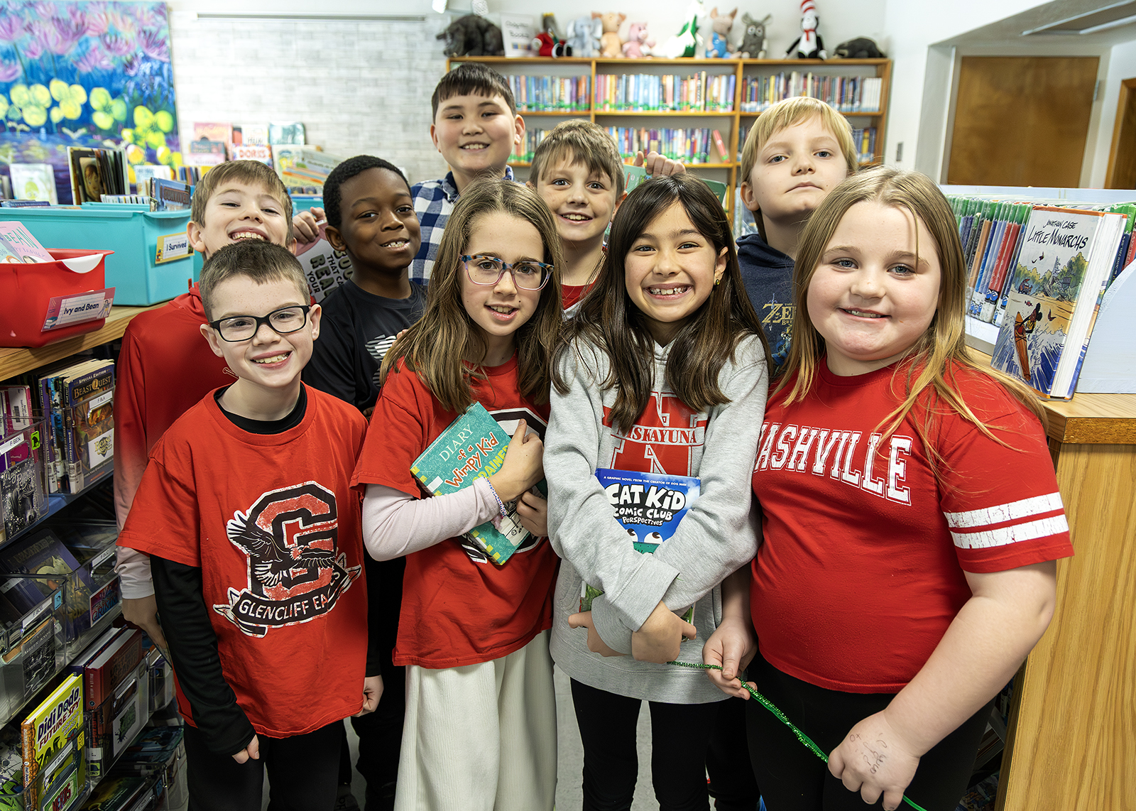 groups of smiling fourth graders