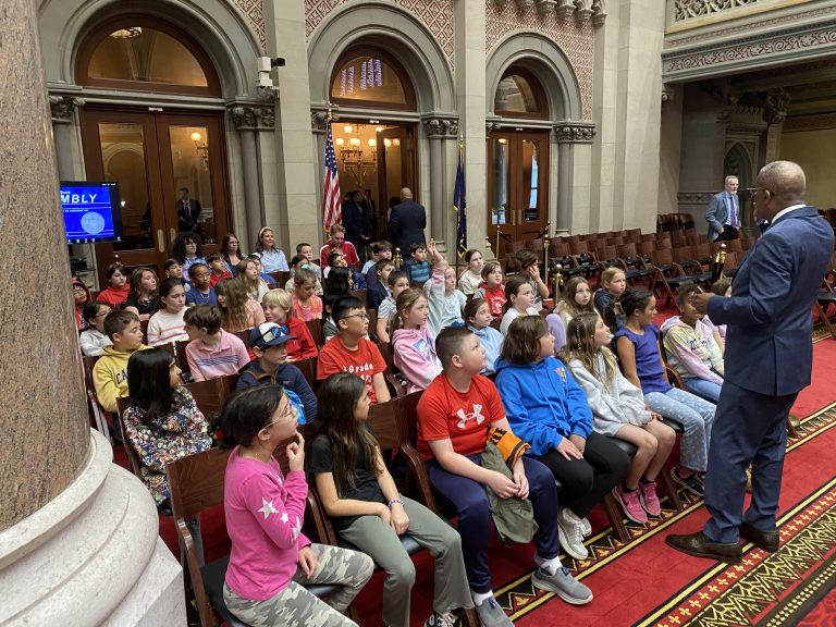 Fourth grade students at Hillside Elementary School engage with a presentation at the state capitol