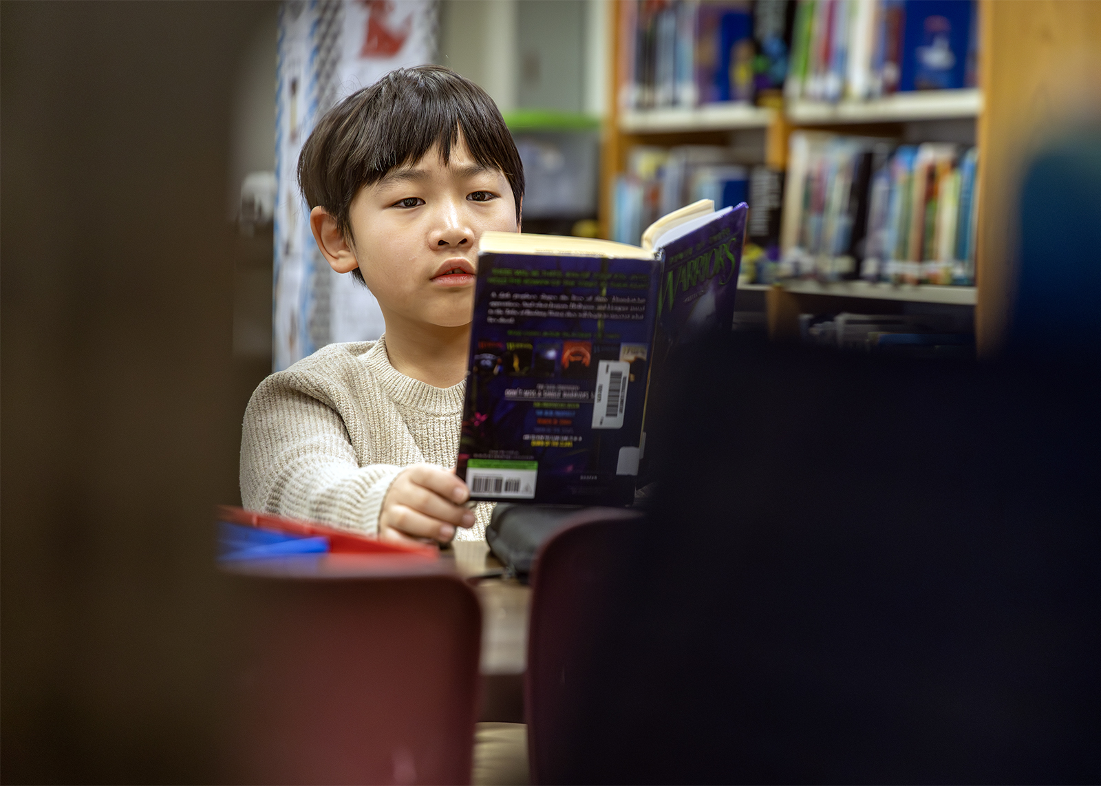 elementary students reads in library