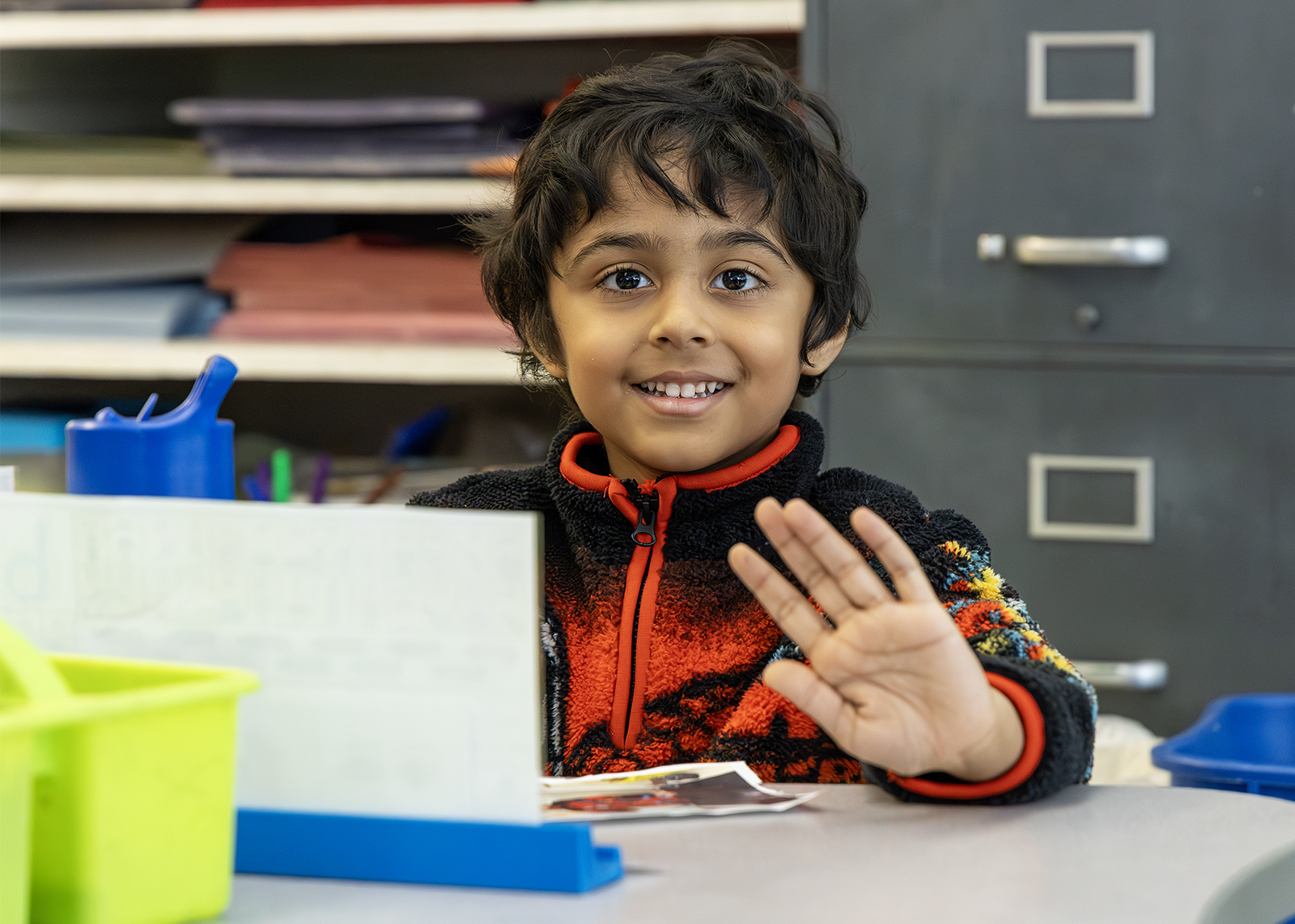kindergarten student waving