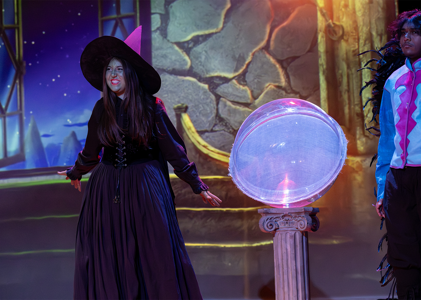 student dressed as the wicked witch in the musical wizard of oz