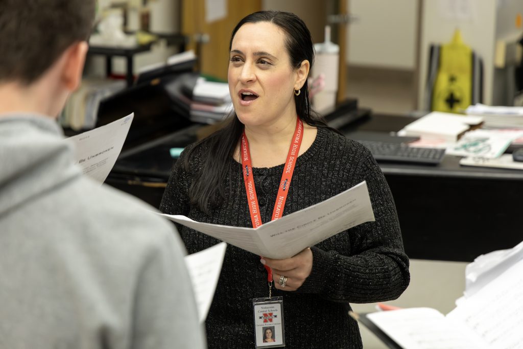 Niskayuna High School vocal teacher Christina Pizzino-Catalano sings with students.