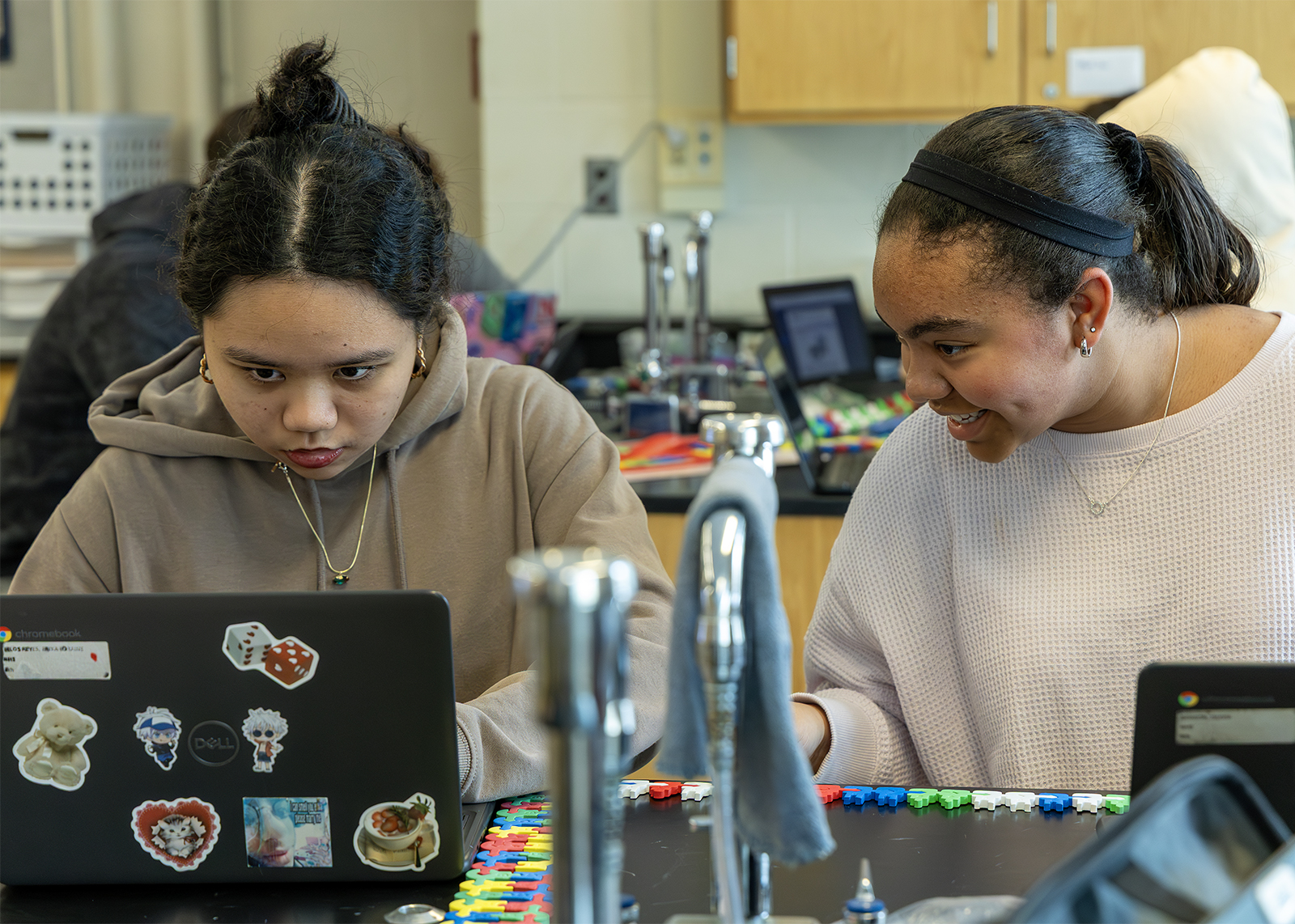 two high school students studying DNA chains
