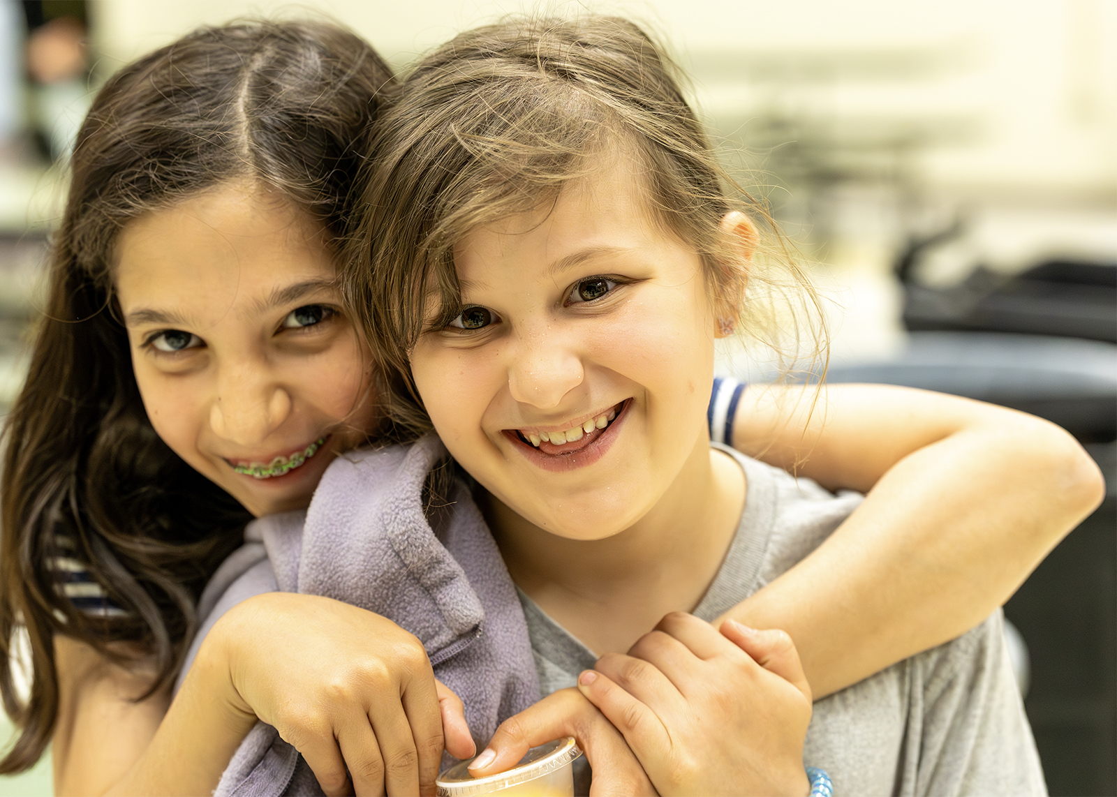 two elementary students smiling at camera