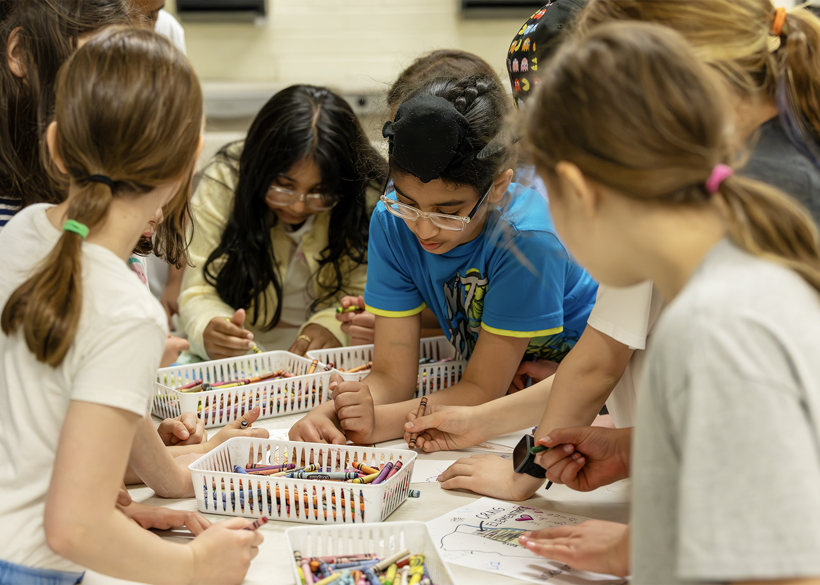 elementary students working on an arts and craft project
