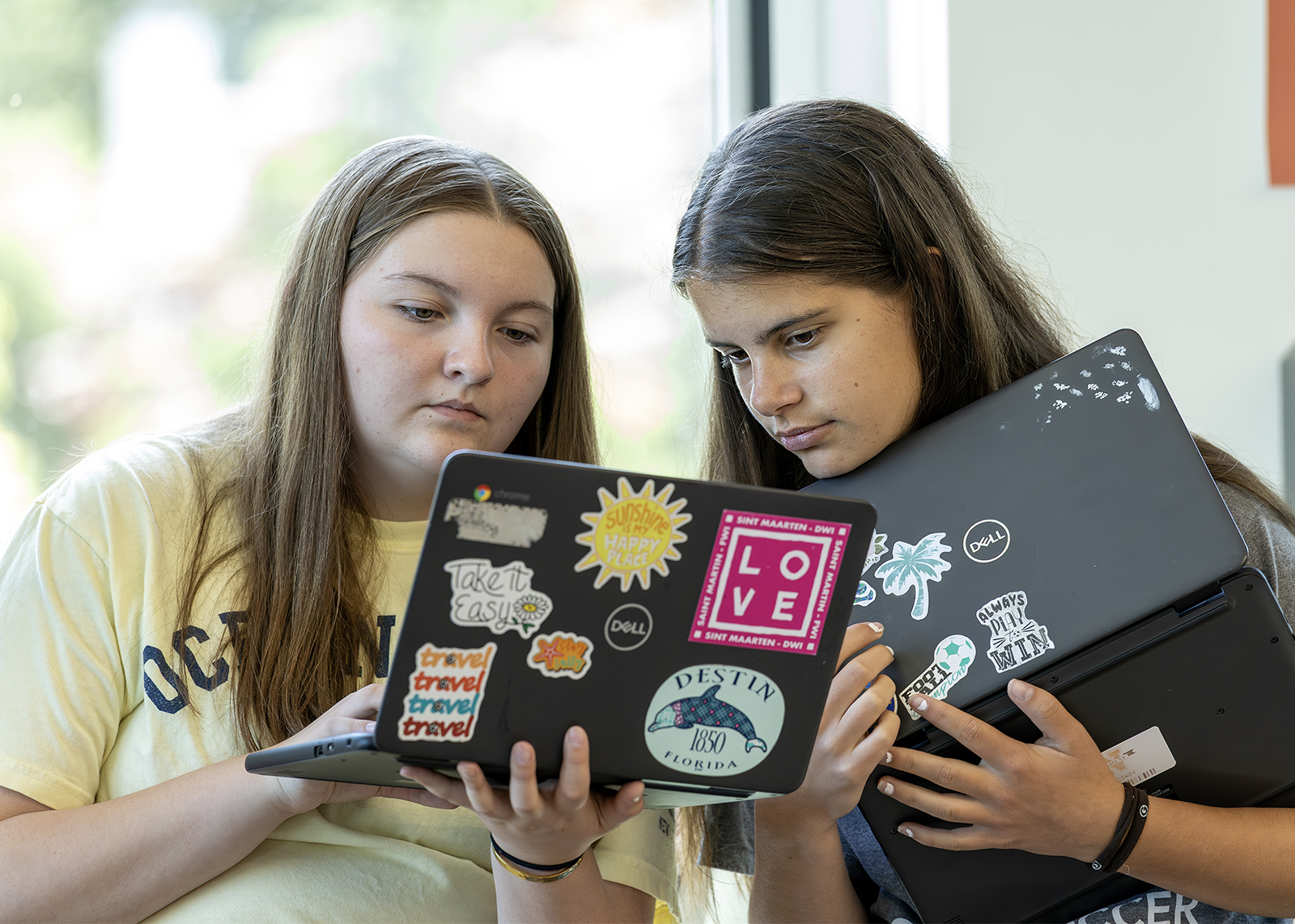 two students doing a lab on chromebooks