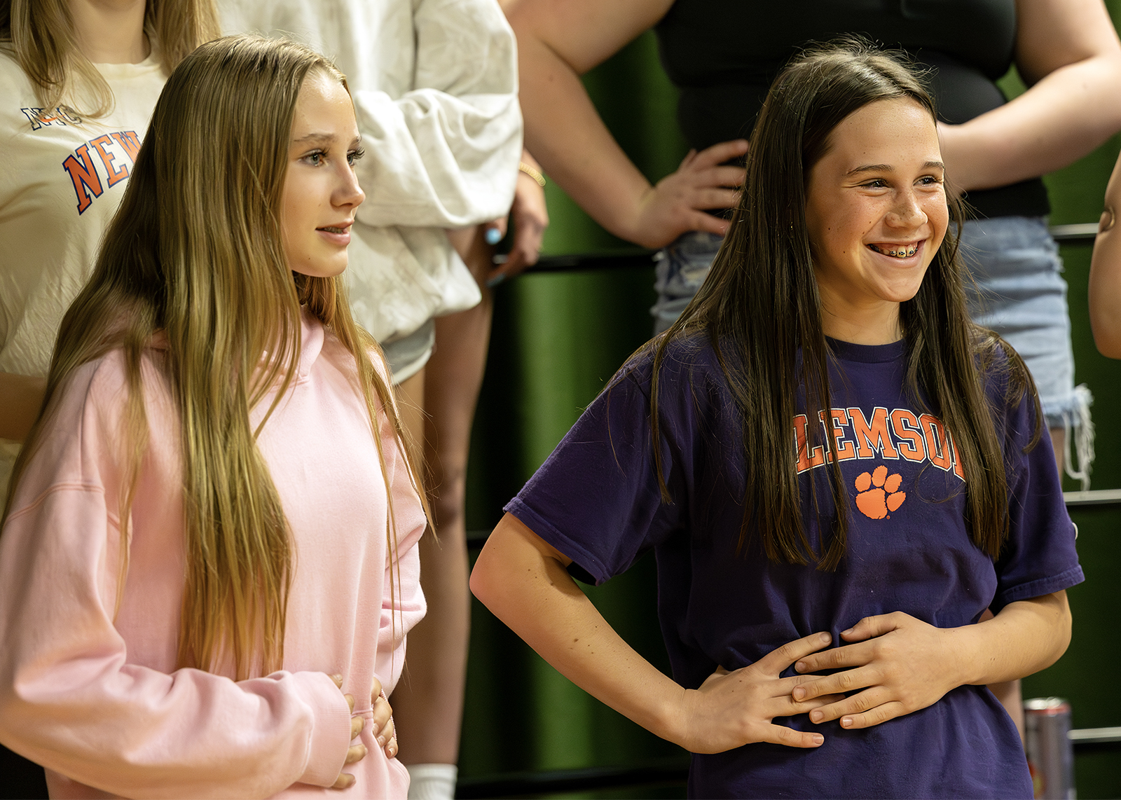 two middle school students warming up in choir