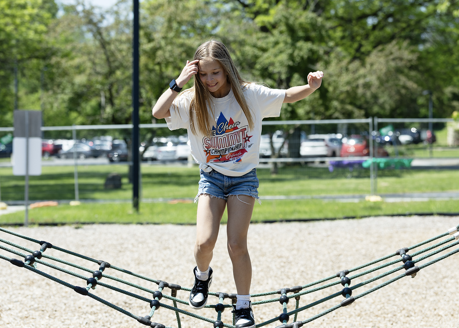 elementary student on cargo net a recess