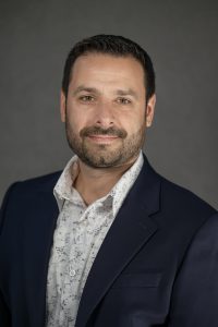 Professional photo of Anthony Malizia. He is smiling and in professional attire.
