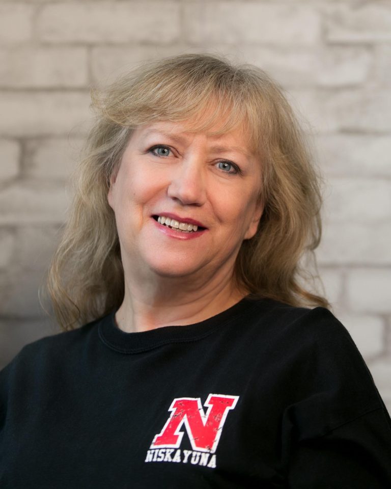 Headshot of Judith Tomisman