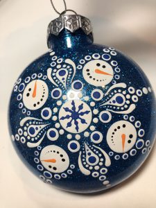 Navy ornament with mandala snowman design.