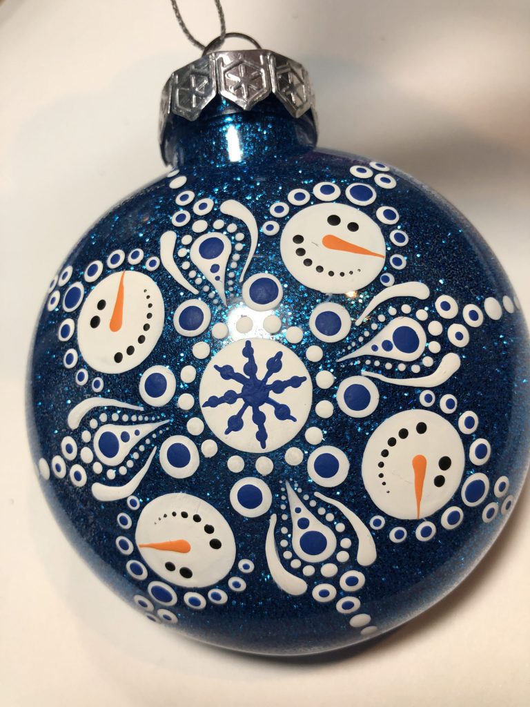 Navy ornament with mandala snowman design.