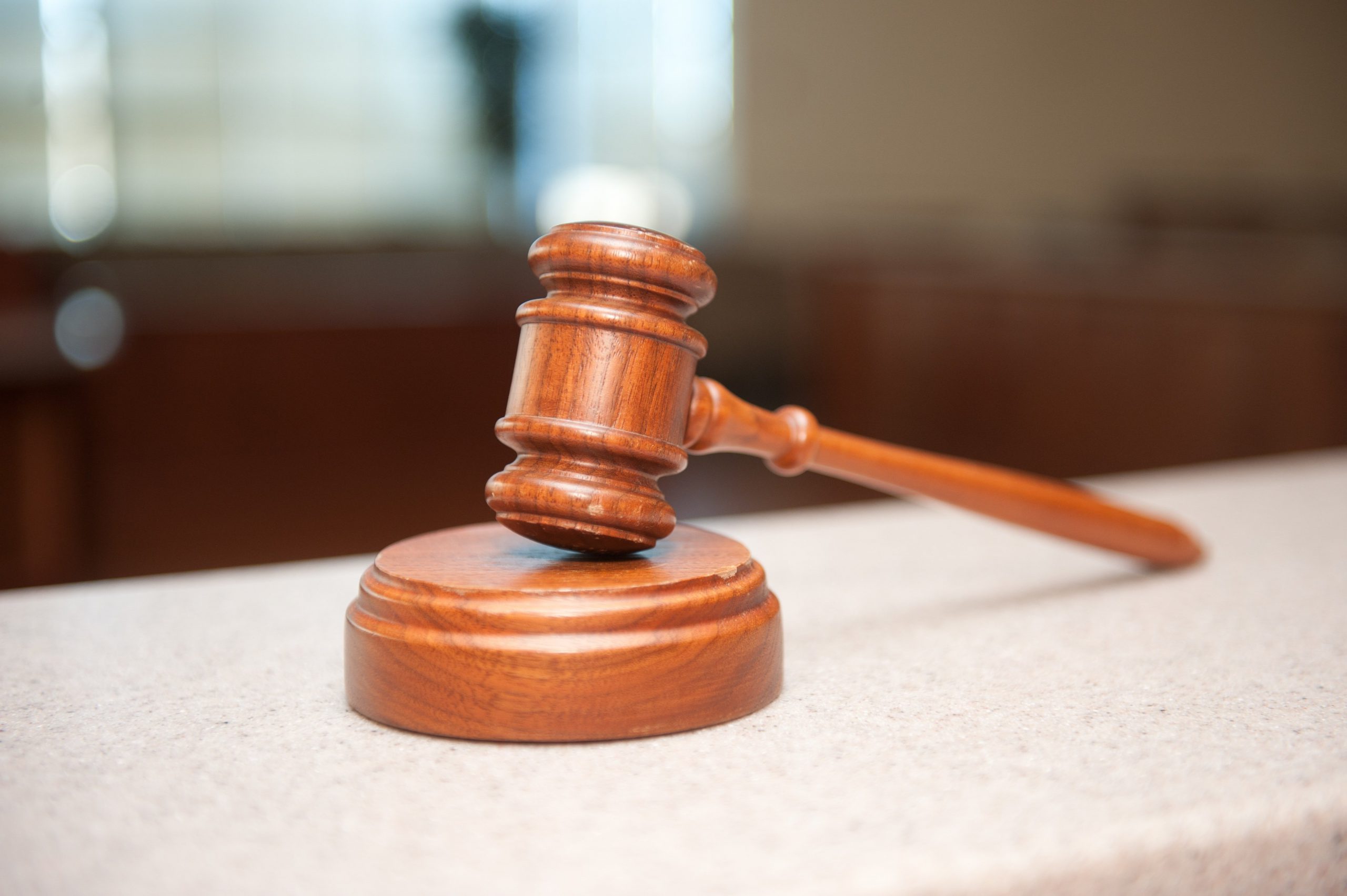 a gavel resting on a platform.