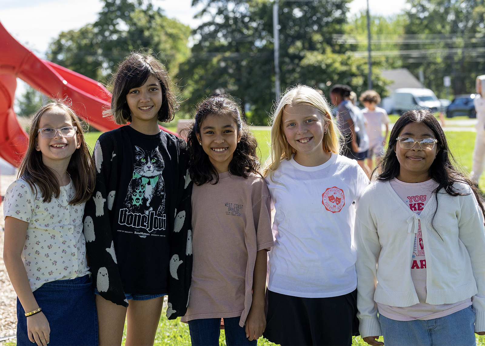 elementary students smiling on the playground