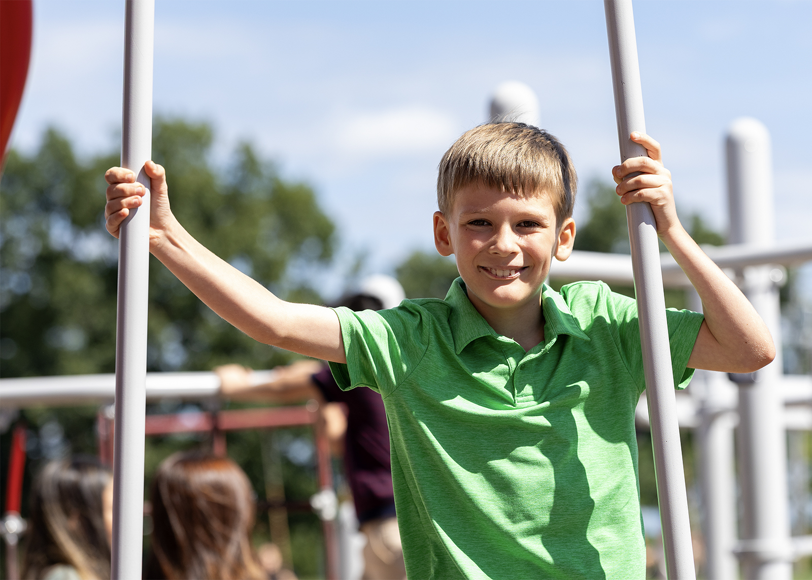 elementary student smiling on the playground