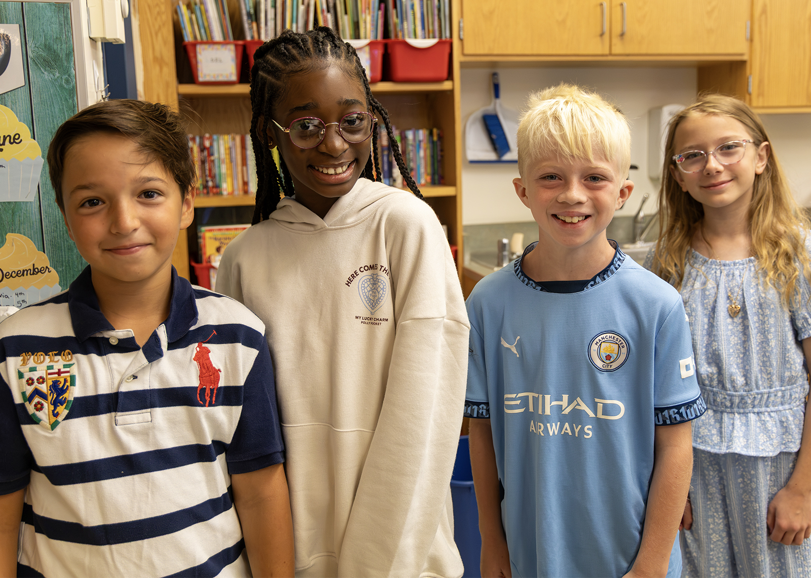 group of elementary students smile