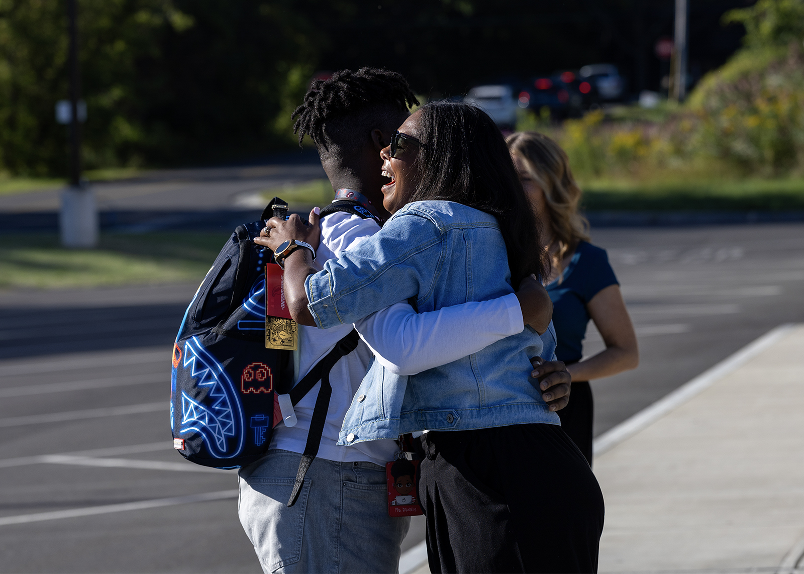 student hugging educator on first day of school
