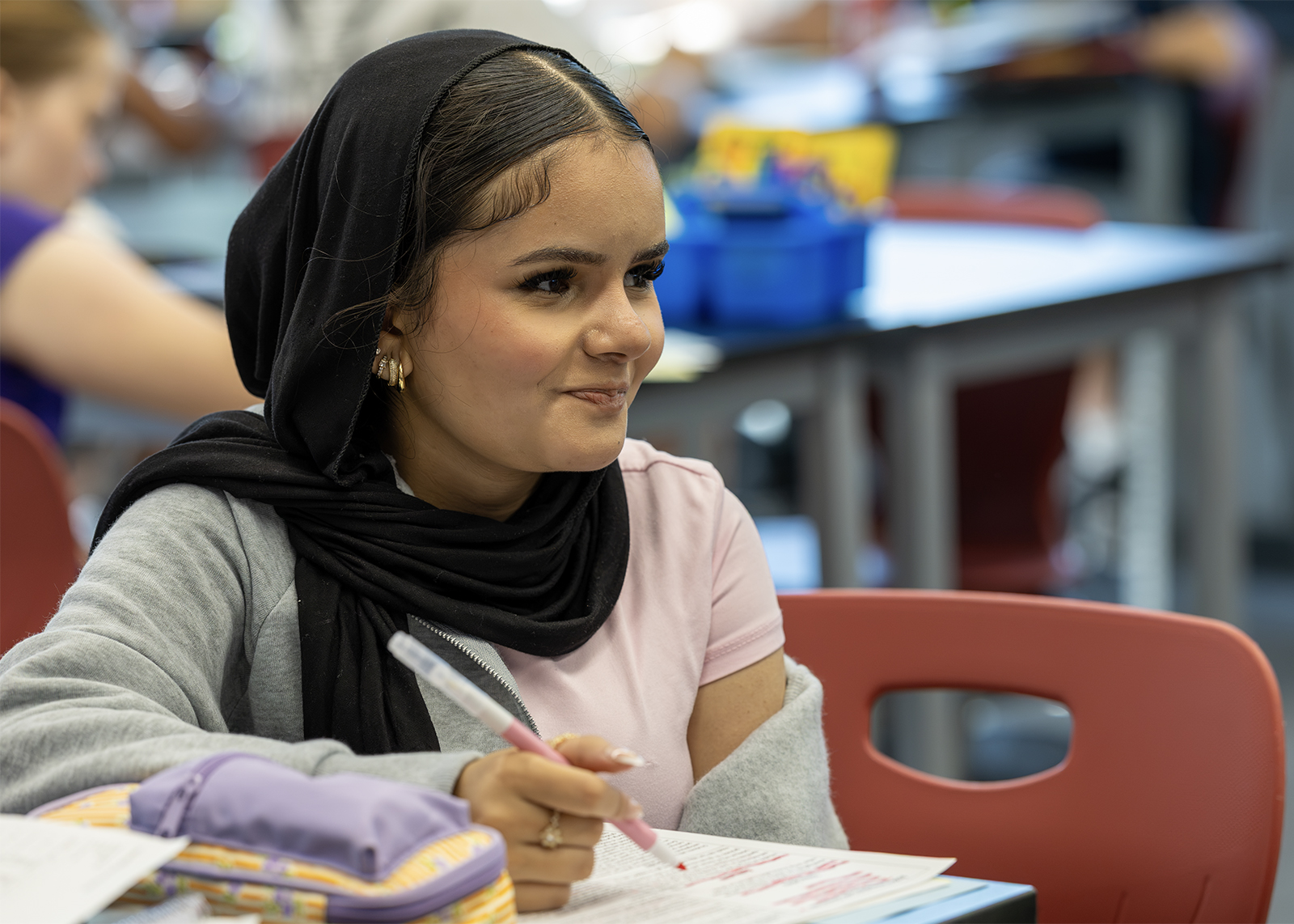 student smiles in sciecne class