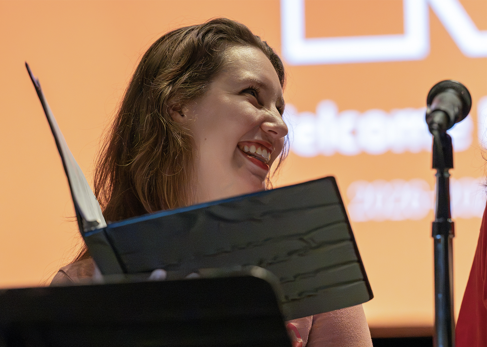 music teacher singing and smiling