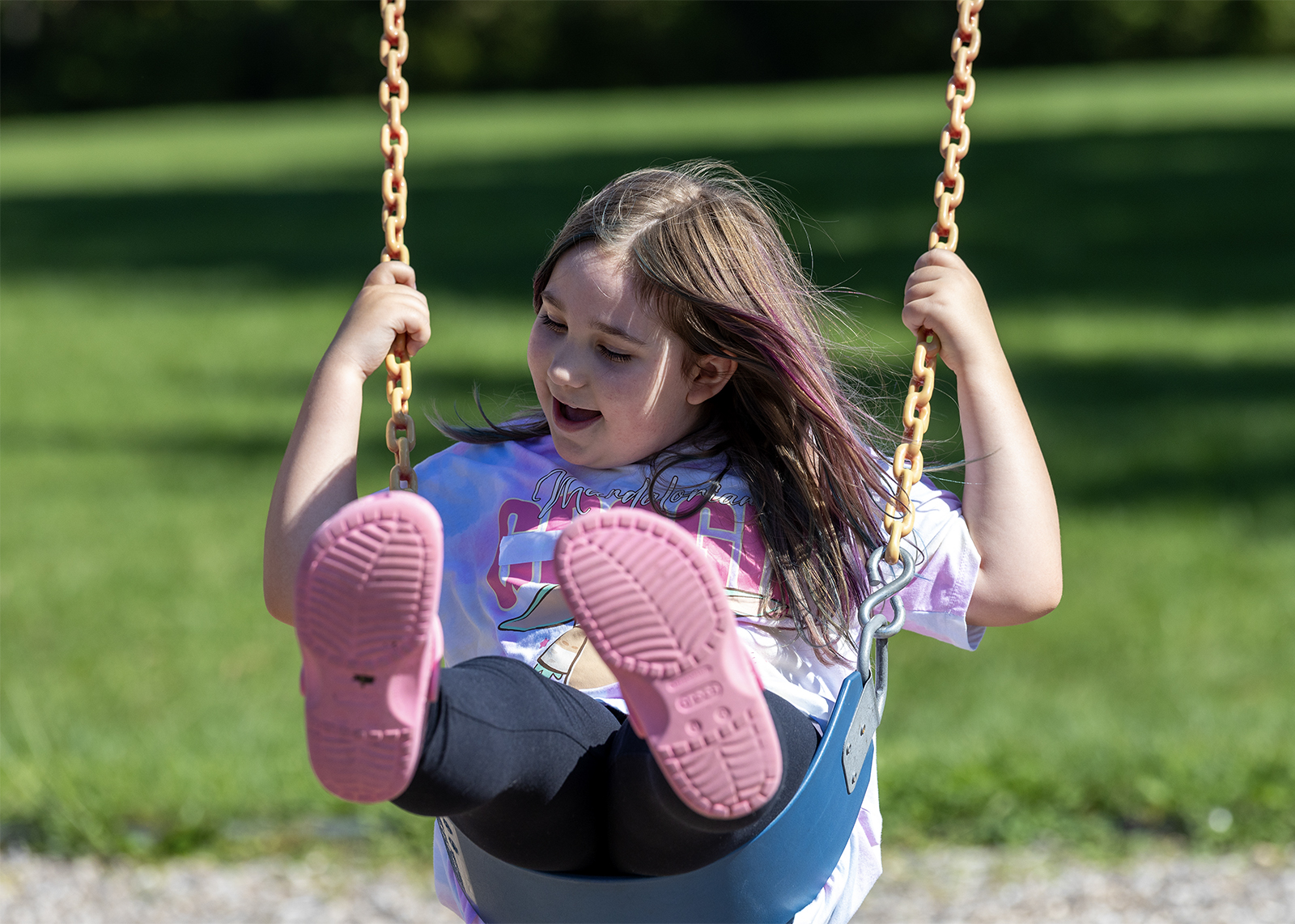 elementary student swinging