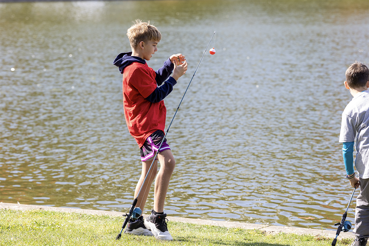  middle school student fishing at community day
